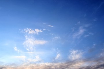Beautiful sunset cloud formations on a orange and blue sky 
