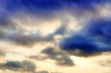 Beautiful sunset cloud formations on a orange and blue sky 