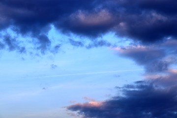 Beautiful sunset cloud formations on a orange and blue sky 