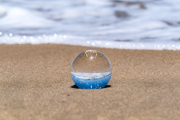 A glass ball on the beach