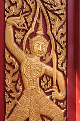 sculptured shutter in a buddhist temple (Wat Chaiyo Wora Wihan) in Ang Thong (Thailand)