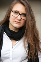young brunette woman wearing eyeglasses