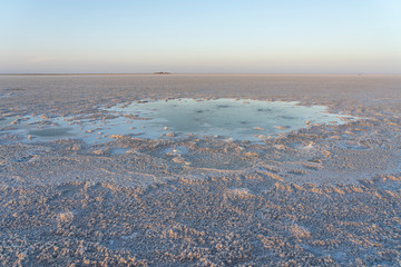 Bubbling pond in the salt plains of Asale Lake in the Danakil Depression in Ethiopia, Africa