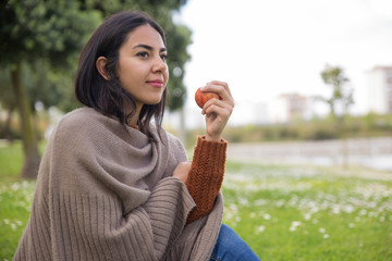 Calm pensive girl spending weekend outdoors