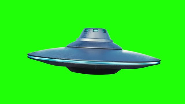 UFO alien spaceship is flying on green background.