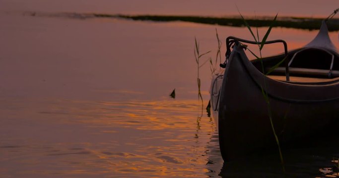 Kayak floating in the sunset