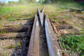 Two railway tracks merge together.