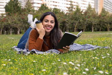 Happy beautiful girl enjoying takeaway coffee