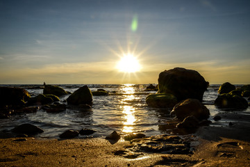 Fototapeta na wymiar tropical beach short before sunset time with sunrays