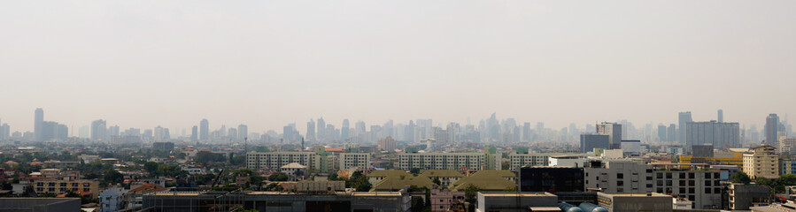 Cityscape urban skyline in the mist or smog. Wide and High view image of Bangkok city in the smog