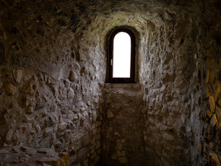 small window inside an ancient hermitage