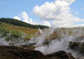 Fototapeta na wymiar Orakei Korako hidden geothermal valley: View on steaming hills (Fumaroles)