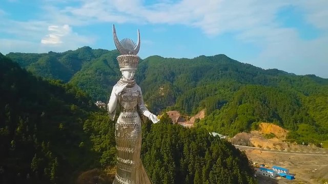 The statue “Yang Asha,” located beside Yang Asha Lake, Jianhe County, Guizhou Province.