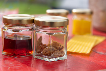 various products such as propolis, honey wax plates against blurred background