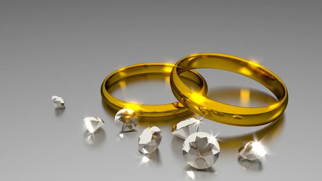 Zwei Eheringe mit Diamanten