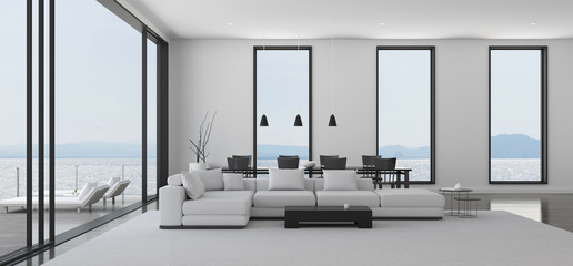 Fototapeta na wymiar View of white living room in minimal style with black and white furniture on dark laminate floor.Interior design with TV and sofa set on sea background. 3d rendering. 