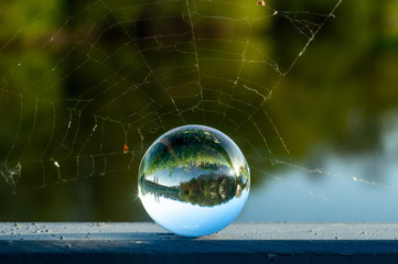 Lens ball river and grass abstract photography