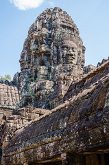 Smiling Faces of Bayon Temple in Angkor Thom is The Heritage of Khmer Empire at Siem Reap Province,...
