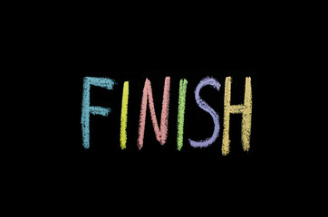 colored text finish drawned on chalkboard