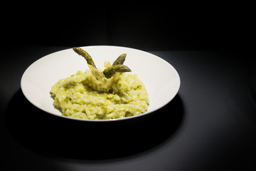 Risotto with asparagus decorated with cheese waffle