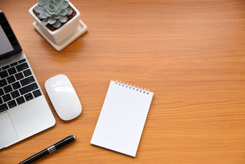 Office table with keyboard,mouse,Notebook,pen and cactus, copy space,Top view, flat lay,minimal style