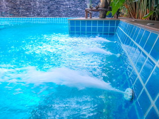 Blue Swimming Pool.Spa corner in the pool.Outdoor Swimming Pool.