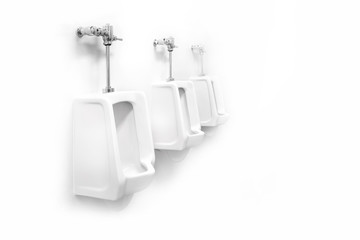 A three white urinals isolated