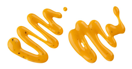 Mustard sauce, splash of honey mustard salad dressing isolated on white background