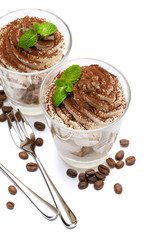 two portions Classic tiramisu dessert in a glass isolated on a white background