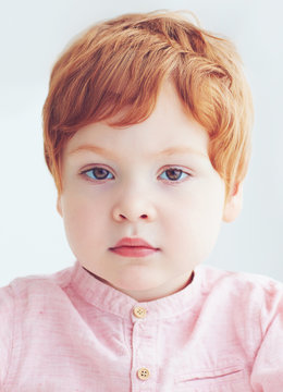 close-up portrait of redhead toddler baby boy of two and a half years old