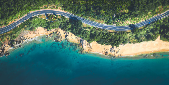 Aerial view of the sandy beach and  road