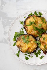 stuffed mushrooms with cheese and herbs on white beautiful dish