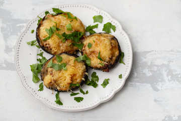 stuffed mushrooms with cheese and herbs on white beautiful dish