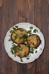 stuffed mushrooms with cheese and herbs on white beautiful dish