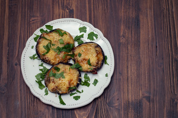 stuffed mushrooms with cheese and herbs on white beautiful dish