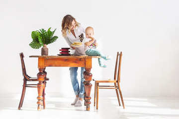 Pretty young mother a confectioner works