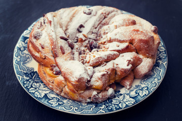 Typical Portuguese Easter Cake with dry nuts on beautiful dish