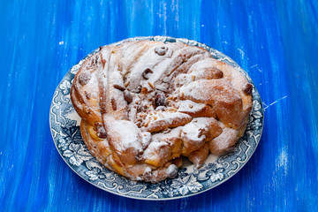 Typical Portuguese Easter Cake with dry fruits and nuts on beautiful dish