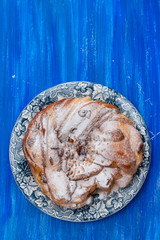 Typical Portuguese Easter Cake with dry fruits and nuts on beautiful dish