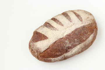 Bread made from whole grain flour located on a white background