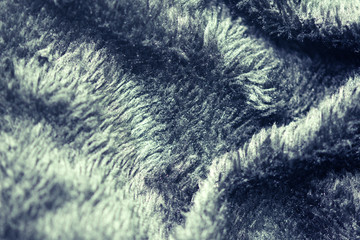 Texture of fur of wild animals background. Line wool floor with black light.