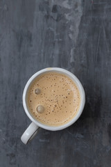 a cup of coffee on ceramic background
