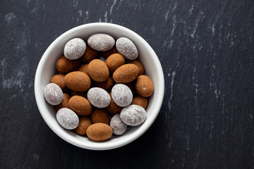 close up of chocolate egg on white dish