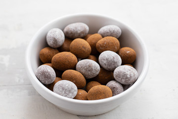 close up of chocolate egg on white dish