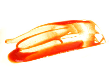 Fresh red ketchup stains Pile up on a white background.