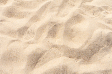 Fototapeta na wymiar Full frame shot. Fine beach sand smooth texture in the summer sun.