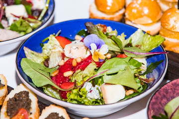 Salad from vegetables and fruit strawberries close-up