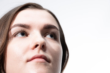 The face of a young girl shot close-up. Expressive eyes.