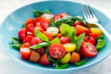 Tomatoes salad with basil