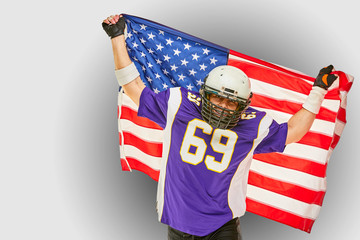 american Football Player with uniform and american flag proud of his country, on a white background.